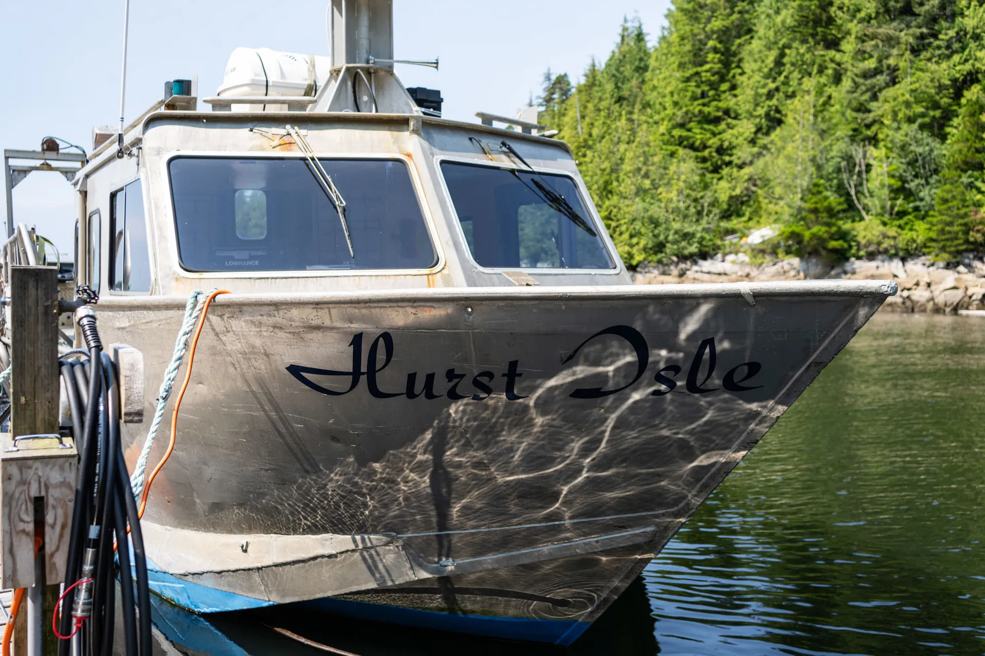 The resort's aluminium crew boat Hurst Isle tied alongside the dock